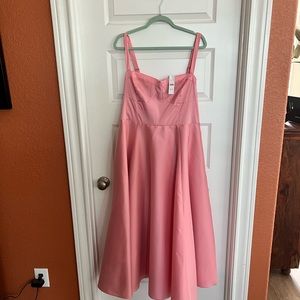 Worn once. In the dry cleaning bag. Perfect dress for a wedding.